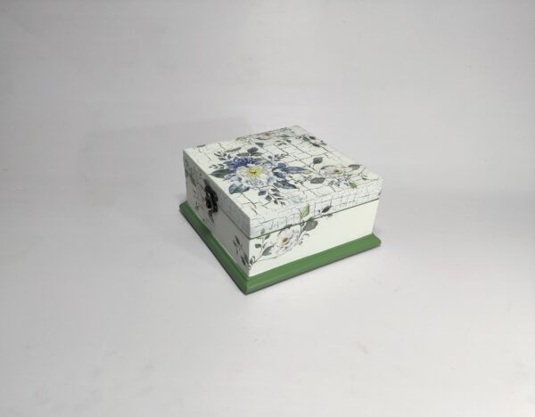 Blue wooden jewellery box with lid closure and decorative details